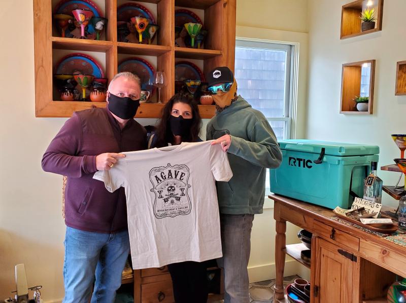 As a sign of appreciation, Agave Mexican Restaurant in Lewes will be giving away 1,000 burritos Monday, May 4. Wearing their socially appropriate masks are (l-r) Agave co-owner Mike Firetti, Agave operations and creative director Jocelyn McKeown and Agave co-owner and founder Chris McKeown. CHRIS FLOOD PHOTO